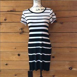form fitting black and white striped dress.